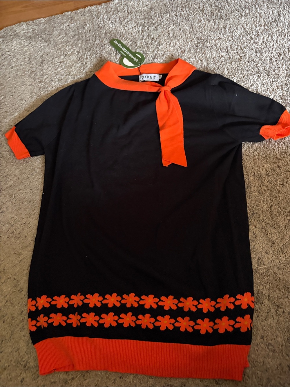 OXKNIT Black Short-Sleeve Knit Top with Orange Trim and Floral Hem